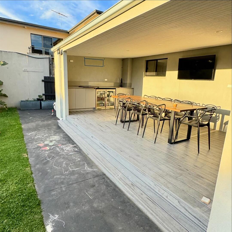 What are the special features of the track design for a heavy-duty lift sliding door?